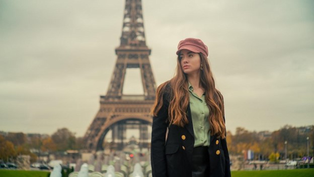 A women with the Eifel Tower in the background