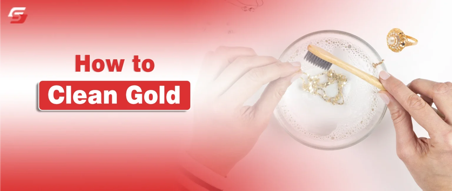 How to Clean Gold Jewelry Safely at Home | Expert Tips for 24k, 18k, White, and Plated Gold Care Hand using a soft toothbrush to clean gold jewelry in a small bowl of warm soapy water.