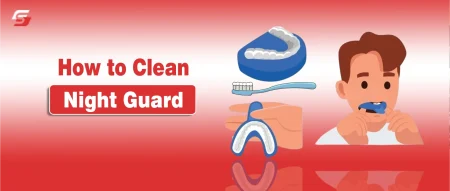 Person cleaning a dental night guard with a soft toothbrush