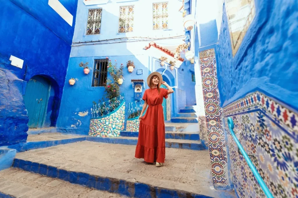 A female traveller visiting Morocco in a happy mood.