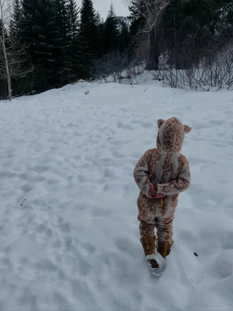 
Daisy bundled up in a playful giraffe-print snowsuit Image Family Moments With Daughter Daisy screenshot by stuffablog